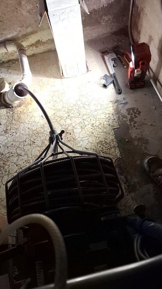 Rodding sewer from cleanout station in basement
